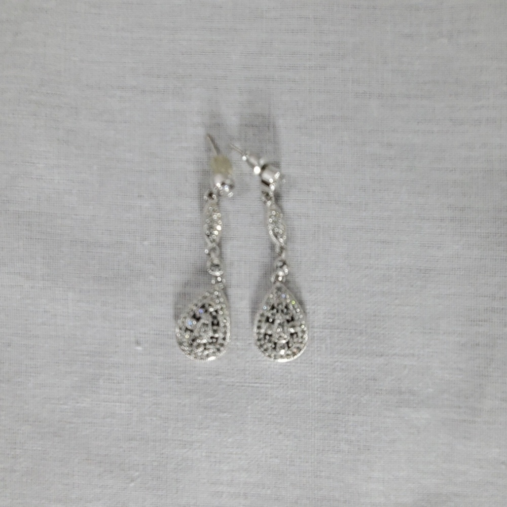 Costume earrings with false diamonds